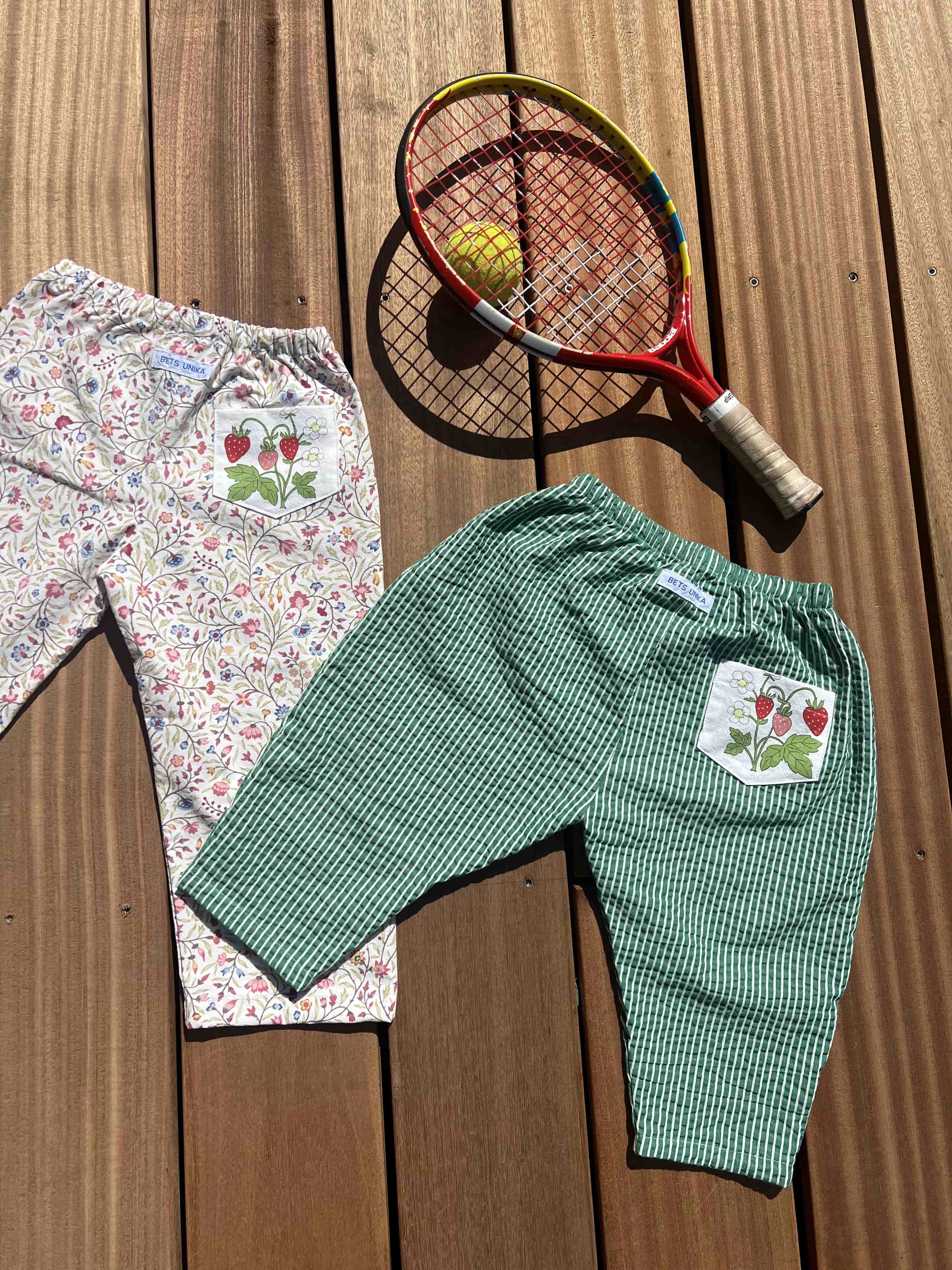 Pants with tennis ketcher